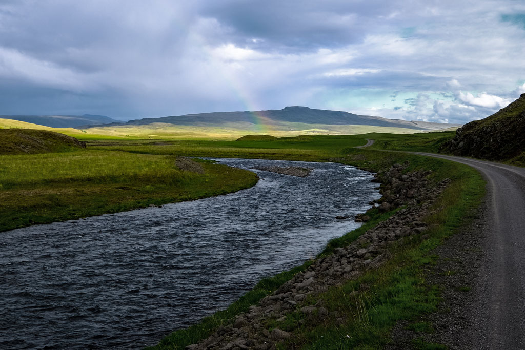 rainbow and a river in the mountains